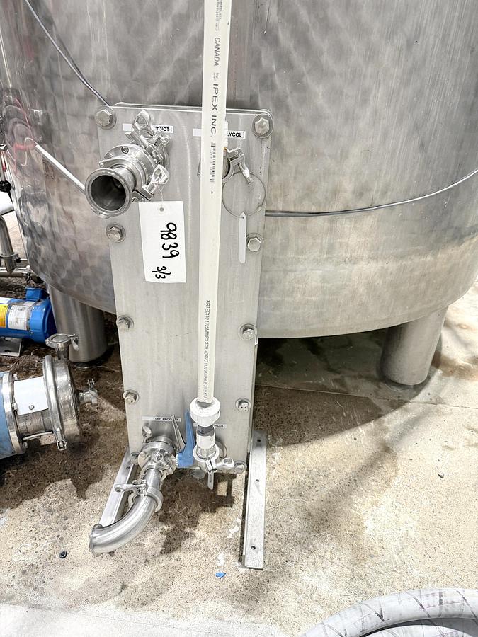 Used Used 2650 Gallon Jacketed Tank, 304 Stainless Steel, With Heat Exchanger & Pump
