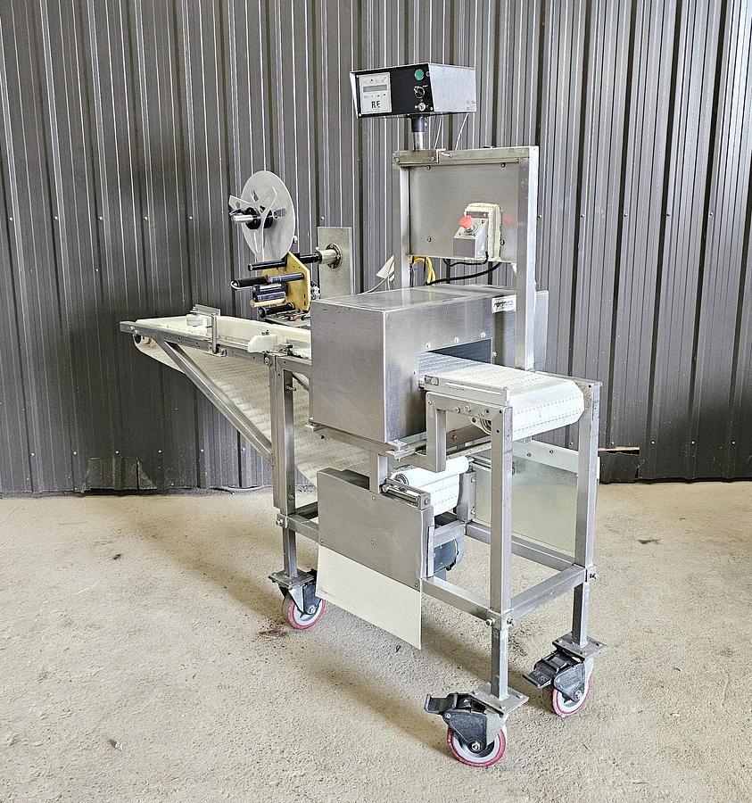 Used Used Fortress Phantom Metal Detector with Belt Conveyor and label applicator