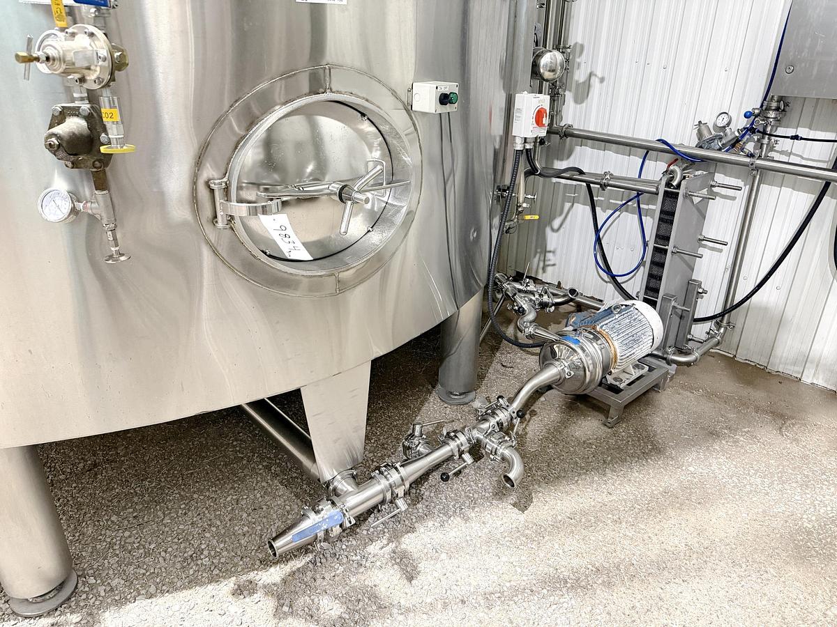 Used Used 13,208 Gallon Tank, 304 Stainless Steel, With Heat Exchanger & Pump