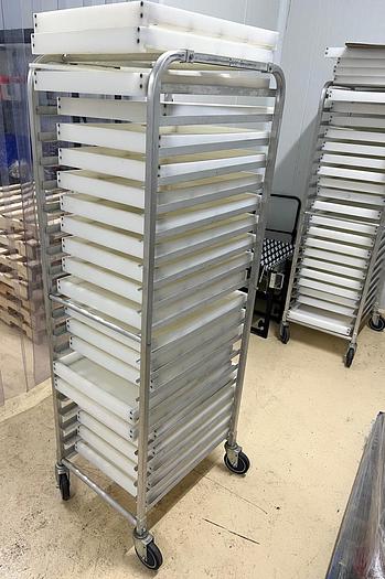 Used LOT OF FOUR STAINLESS STEEL MOBILE RACKS WITH POLY TRAYS