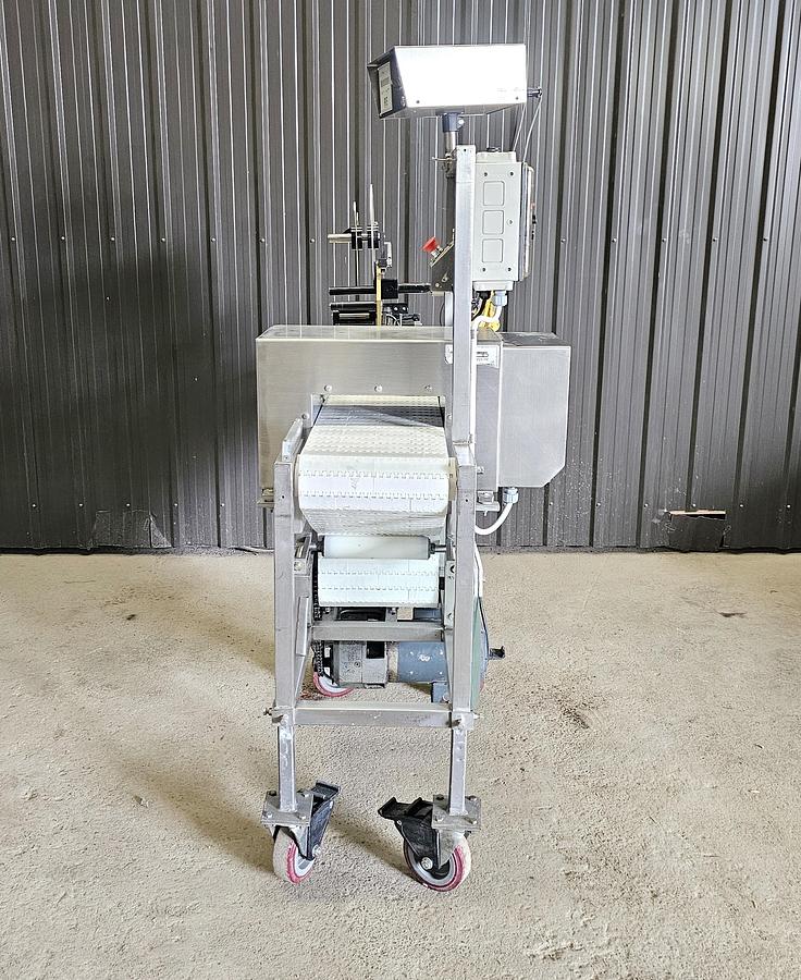 Used Used Fortress Phantom Metal Detector with Belt Conveyor and label applicator