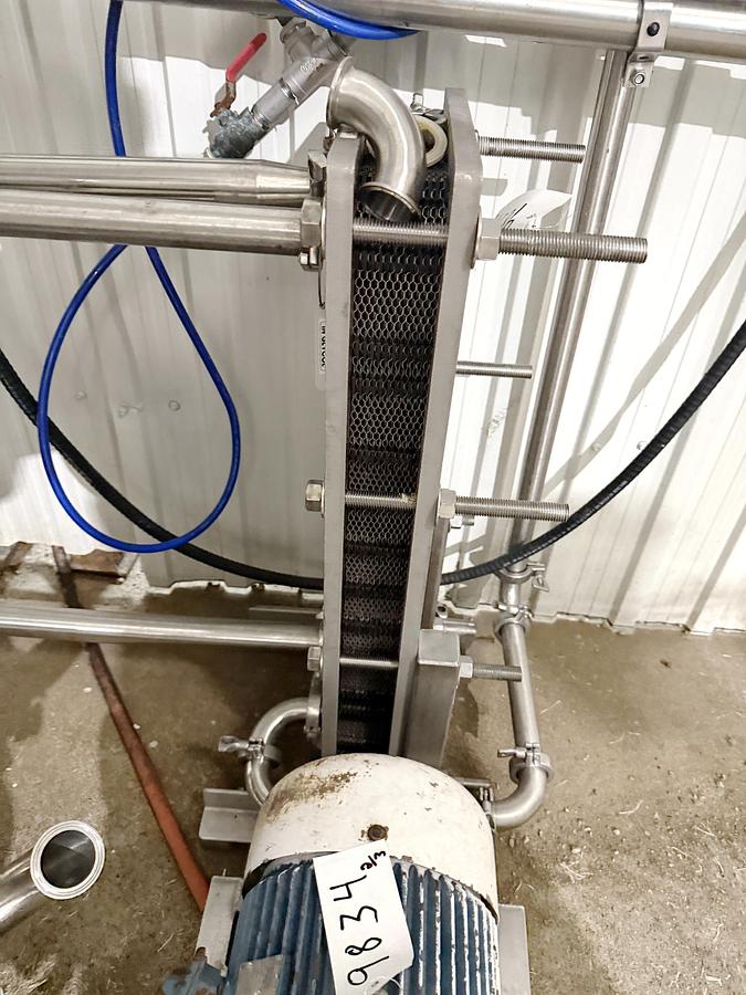 Used Used 13,208 Gallon Tank, 304 Stainless Steel, With Heat Exchanger & Pump