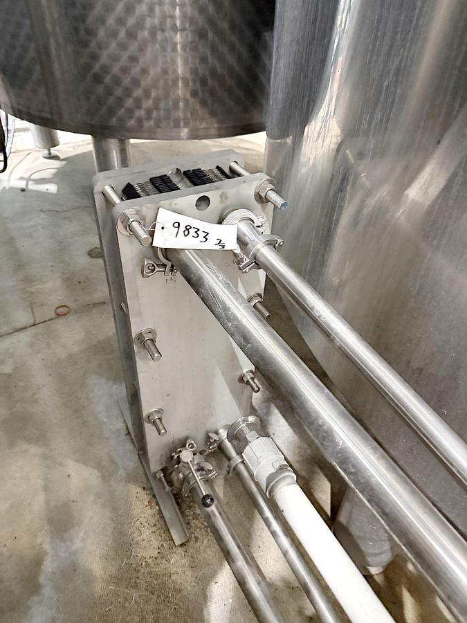 Used Used 13,208 Gallon Tank, 304 Stainless Steel, With Heat Exchanger & Pump