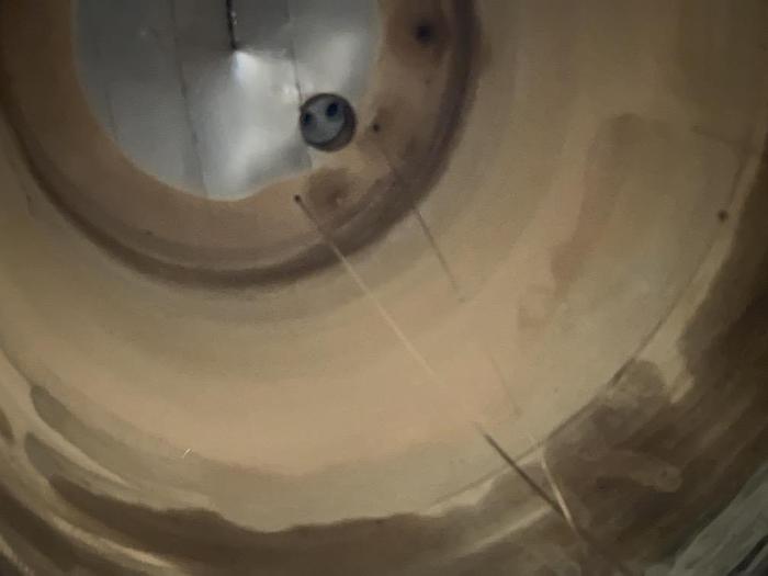 Used Used approximately 11,000 gallon stainless steel vertical tank