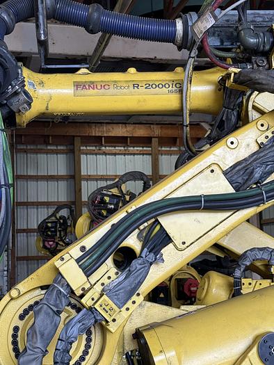 Used FANUC R-2000iC/165F ROBOT WITH R-30iB 7TH & 8 AXIS CONTROL ON 3 METER RTU WITH SERVO SPOT WELD GUN 2 UNITS AVAILABLE