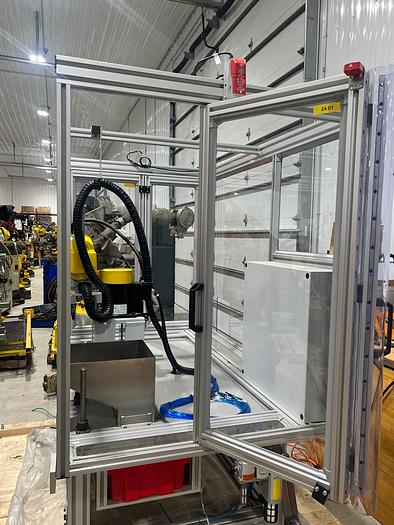 Used FANUC SR6iA ROBOT CELL WITH R30iB PLUS COMPACT CONTROLLER, TEACH PENDANT, CABLES, ENCLOSURE