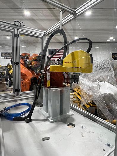 Used FANUC SR6iA ROBOT CELL WITH R30iB PLUS COMPACT CONTROLLER, TEACH PENDANT, CABLES, ENCLOSURE