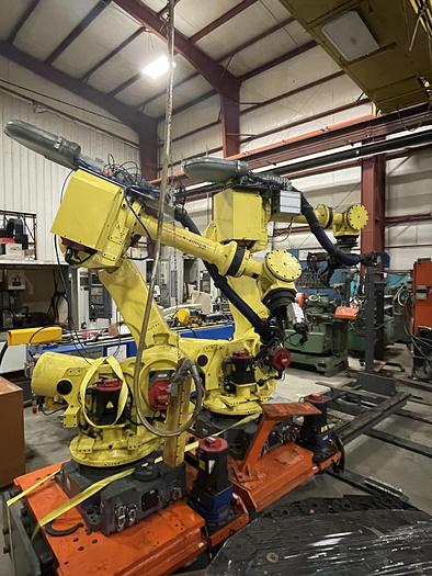 Used FANUC R-2000iB/210F ROBOT RTU CELL WITH 2 ROBOTS, R30IA CONTROLS AND 50' OF TRAVEL.