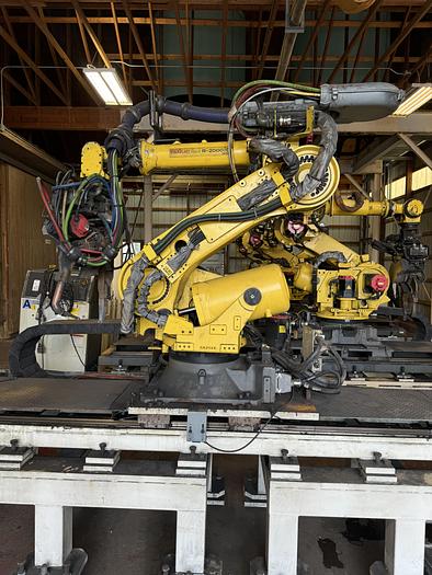 Used FANUC R-2000iC/165F ROBOT WITH R-30iB 7TH & 8 AXIS CONTROL ON 3 METER RTU WITH SERVO SPOT WELD GUN 2 UNITS AVAILABLE