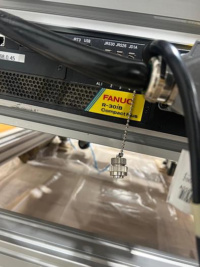 Used FANUC SR6iA ROBOT CELL WITH R30iB PLUS COMPACT CONTROLLER, TEACH PENDANT, CABLES, ENCLOSURE