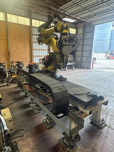 Used FANUC R-2000iC/165F ROBOT WITH R-30iB 7TH & 8 AXIS CONTROL ON 3 METER RTU WITH SERVO SPOT WELD GUN 2 UNITS AVAILABLE