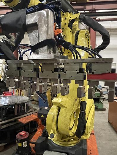 Used FANUC R-2000iB/210F ROBOT RTU CELL WITH 2 ROBOTS, R30IA CONTROLS AND 50' OF TRAVEL.