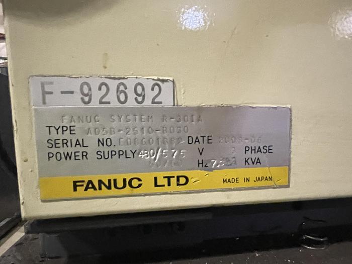 Used FANUC R-2000iB/210F ROBOT RTU CELL WITH 2 ROBOTS, R30IA CONTROLS AND 50' OF TRAVEL.