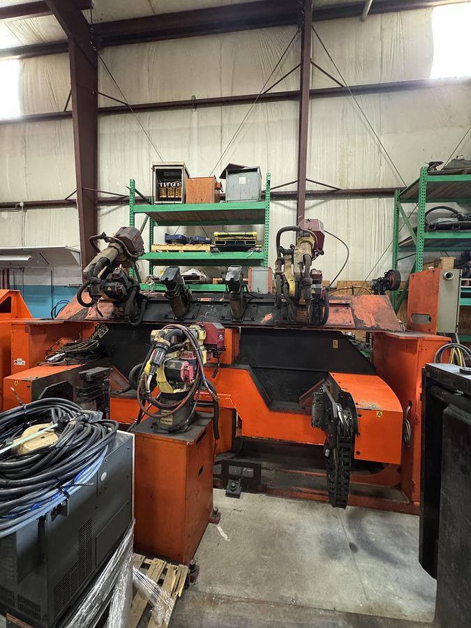 Used GENESIS SYSTEM 3X DUAL TRUNION MIG WELDING CELL WITH 2 ARC MATE 100iC R-30iB ROBOTS