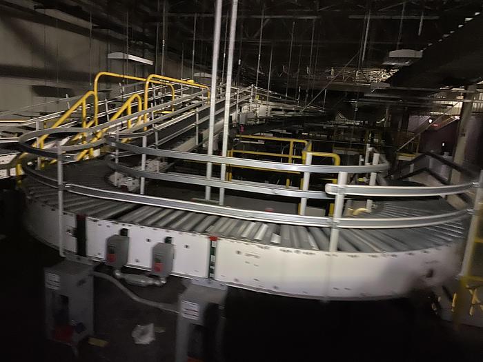 Used 1000’ OF ROLLER CONVEYOR WITH CURVING TRACK