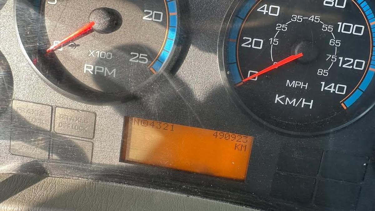 Used 2010 International 7600 Crane truck with a dump box