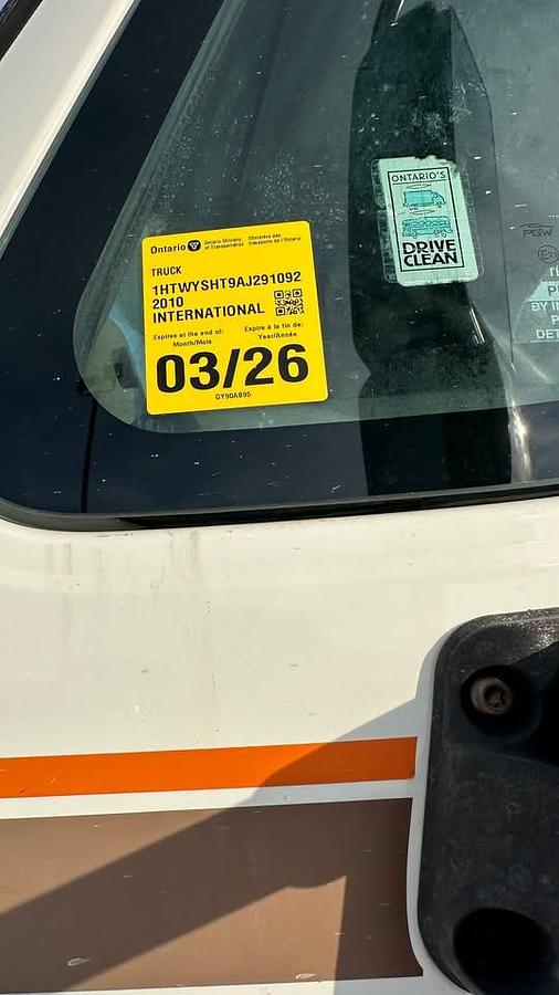 Used 2010 International 7600 Crane truck with a dump box