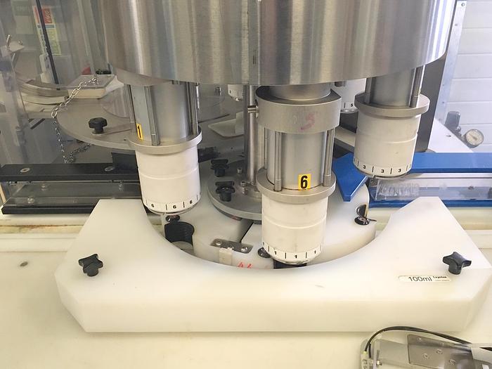 Used Romaco Bosspak MC8000 6 head Capper