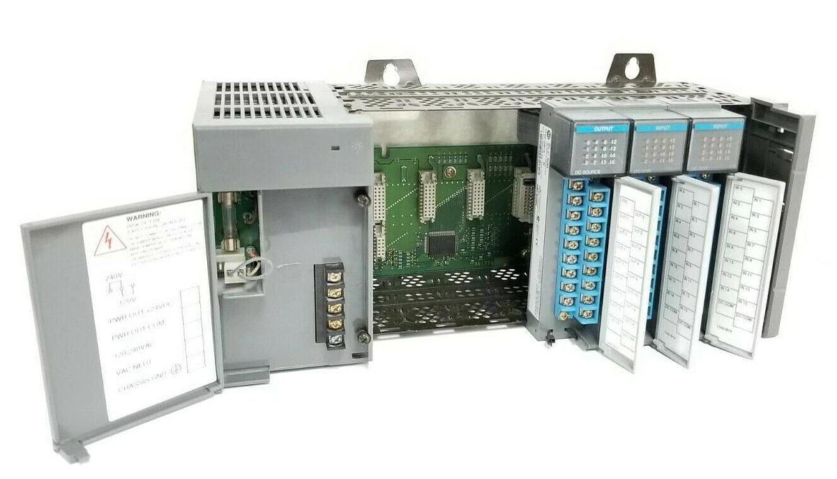 Used ALLEN BRADLEY 1746-A7 SLOT RACK W/ 1746-P2 , (2) 1746-IB16 , 1746-OB16 (DAMAGED)