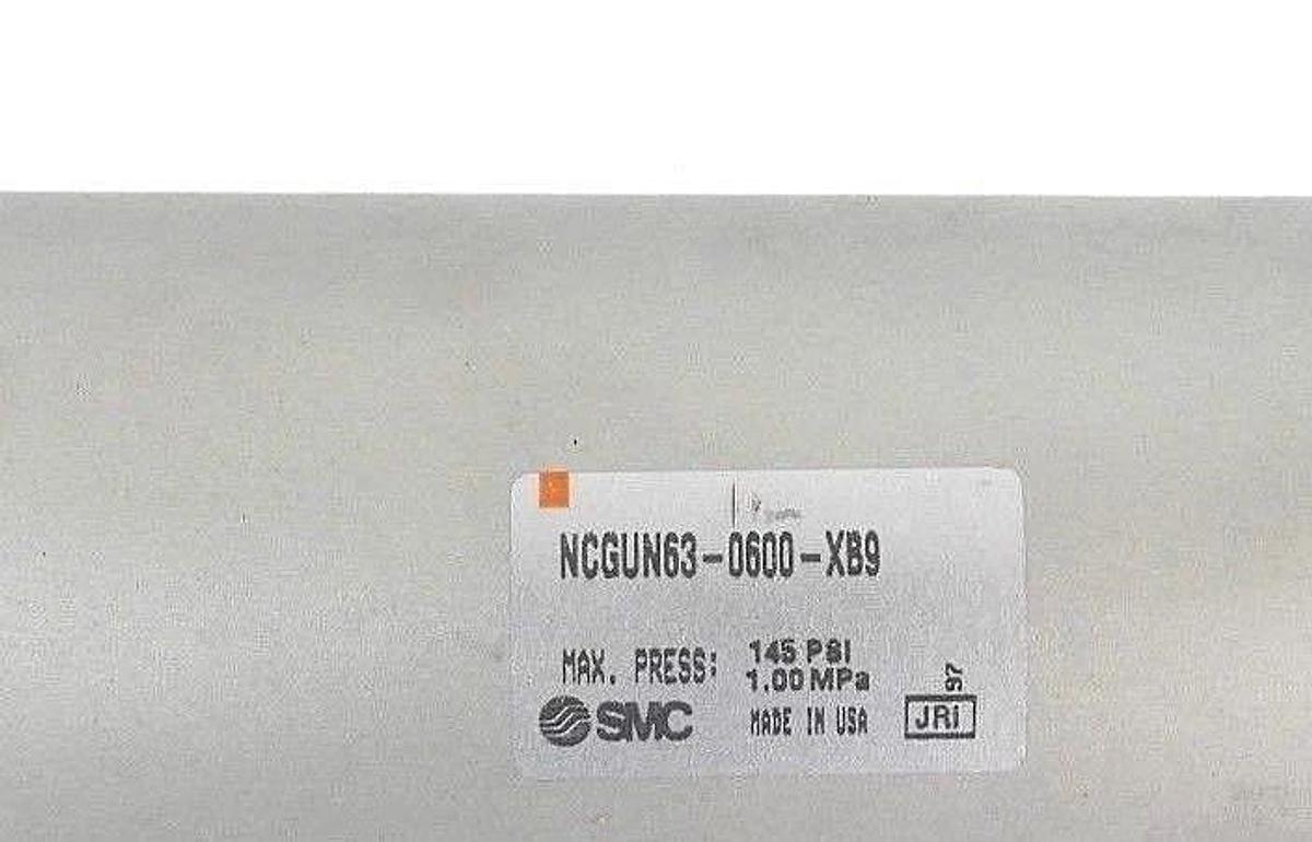 NEW SMC NCGUN63-0600-XB9 AIR CYLINDER MAX. PRESS: 145 PSI, 1.00 MPA