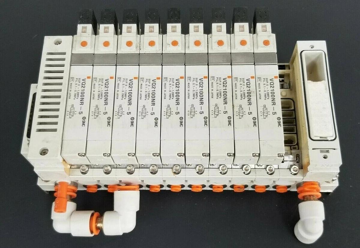 Used SMC 10 POS. MANIFOLD BLOCK WITH (9) VQ2100NR-5 PLUG-IN SOLENOID VALVES VQ2100NR5
