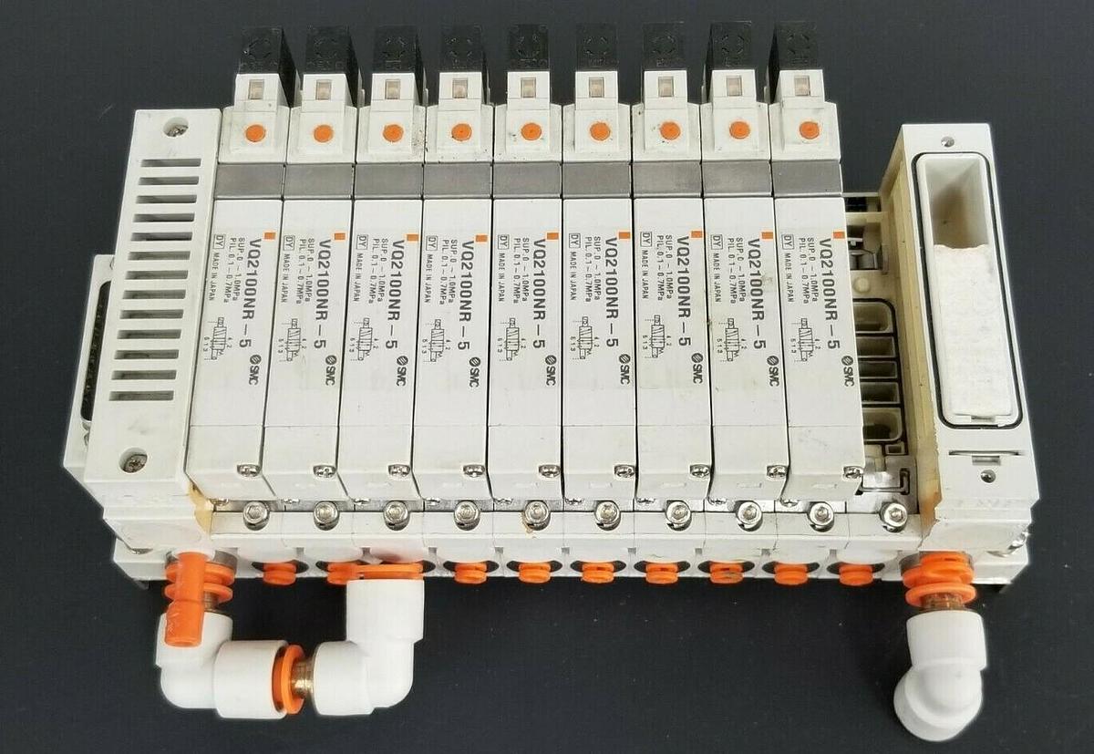 Used SMC 10 POS. MANIFOLD BLOCK WITH (9) VQ2100NR-5 PLUG-IN SOLENOID VALVES VQ2100NR5