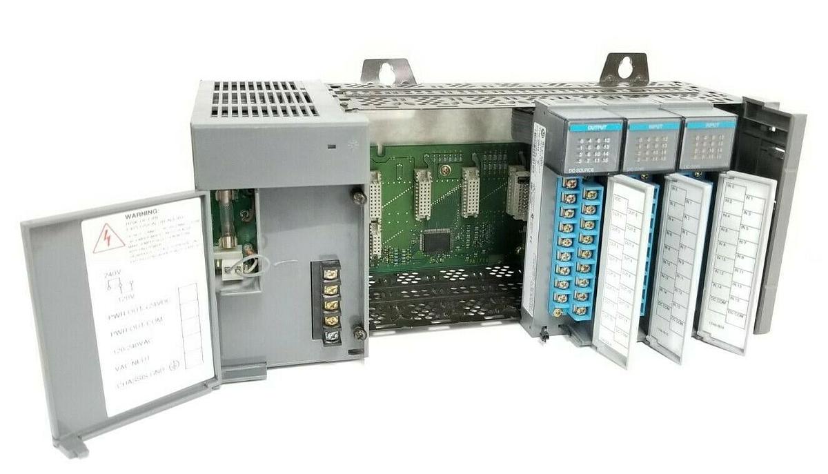 Used ALLEN BRADLEY 1746-A7 SLOT RACK W/ 1746-P2 , (2) 1746-IB16 , 1746-OB16 (DAMAGED)