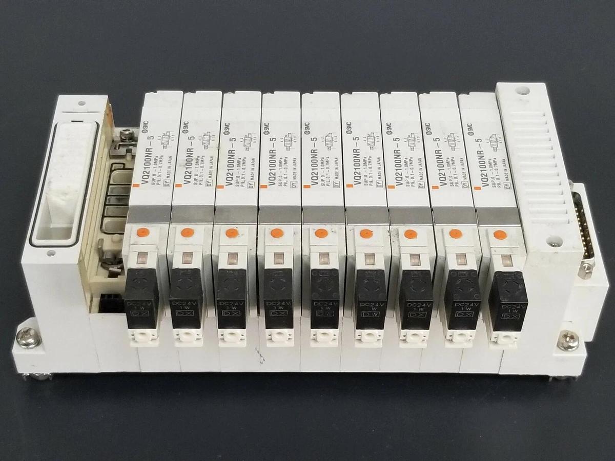Used SMC 10 POS. MANIFOLD BLOCK WITH (9) VQ2100NR-5 PLUG-IN SOLENOID VALVES VQ2100NR5