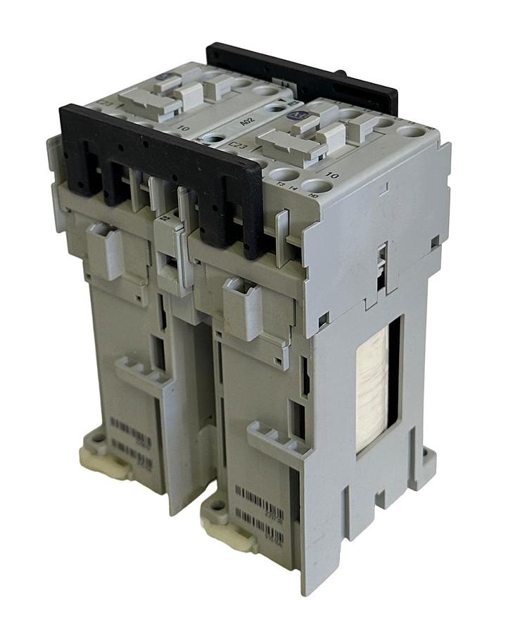 Used NEW ALLEN BRADLEY 104-C23ZP22 /C REVERSING CONTACTOR 3-POLE 115Vdc 104C23ZP22