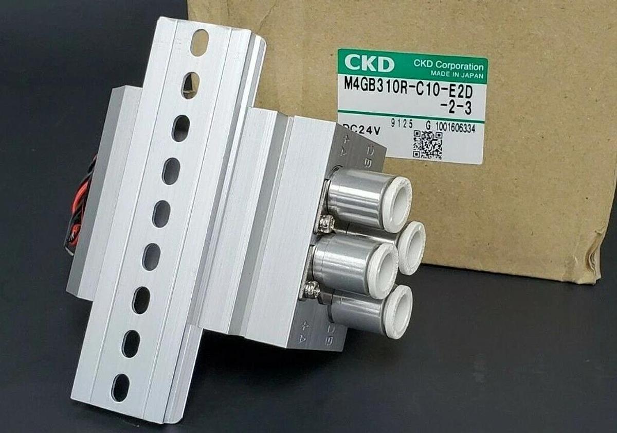Used NIB CKD M4GB310R-C10-E2D-2-3 VALVE MANIFOLD ASSEMBLY DC24V M4GB310RC10E2D23