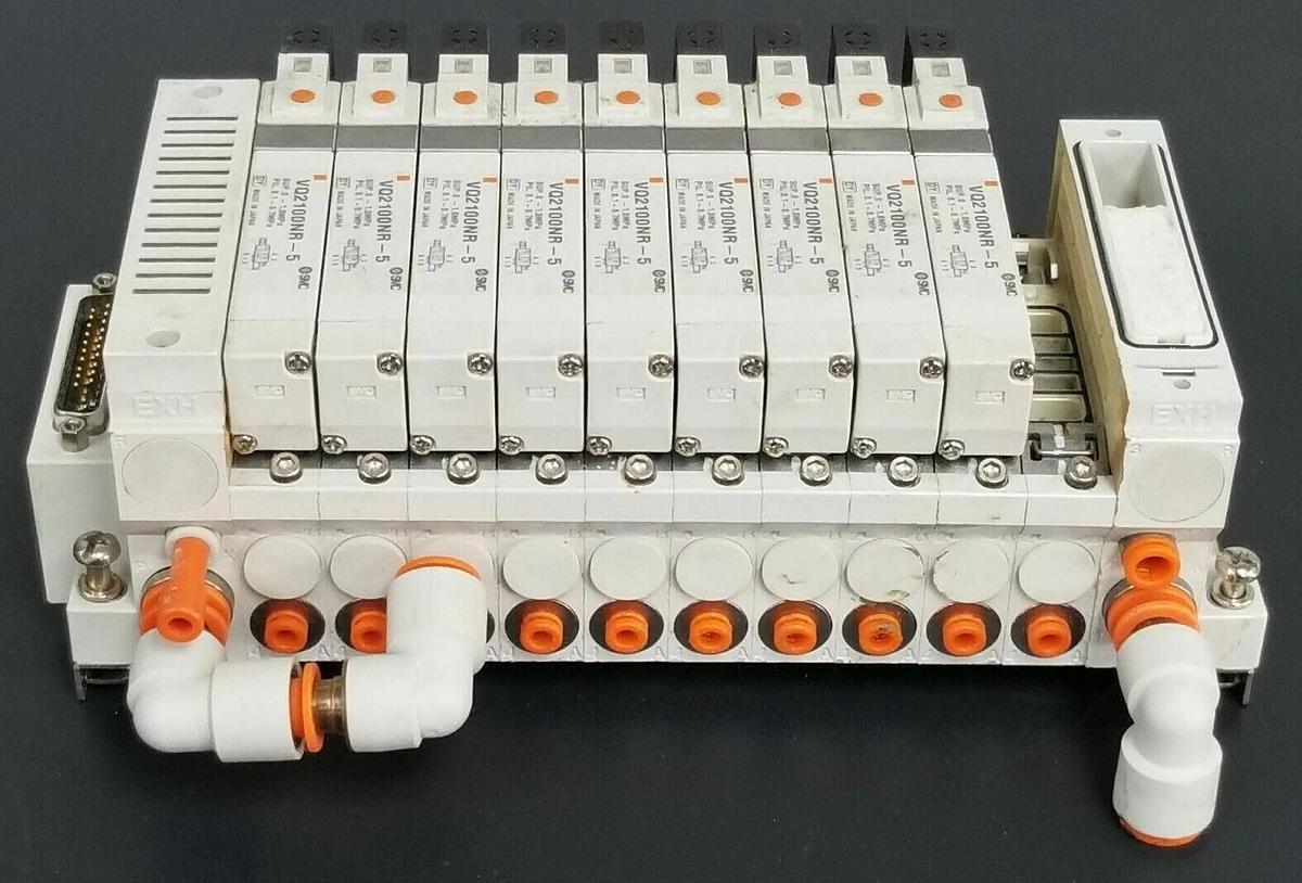 Used SMC 10 POS. MANIFOLD BLOCK WITH (9) VQ2100NR-5 PLUG-IN SOLENOID VALVES VQ2100NR5