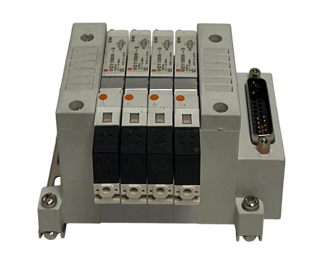 Used SMC EXH MANIFOLD BANK/BLOCK 4-PORT W/ VQ1100N-5 SOLENOID VALVES 24VDC USNP