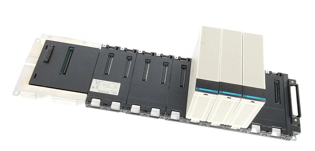 Used OMRON CS1W-BC102 SLOT RACK BASE UNIT W/ (3) CS1W-SP001 SPACE UNITS