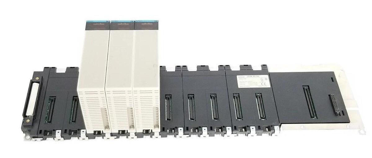 Used OMRON CS1W-BC102 SLOT RACK BASE UNIT W/ (3) CS1W-SP001 SPACE UNITS