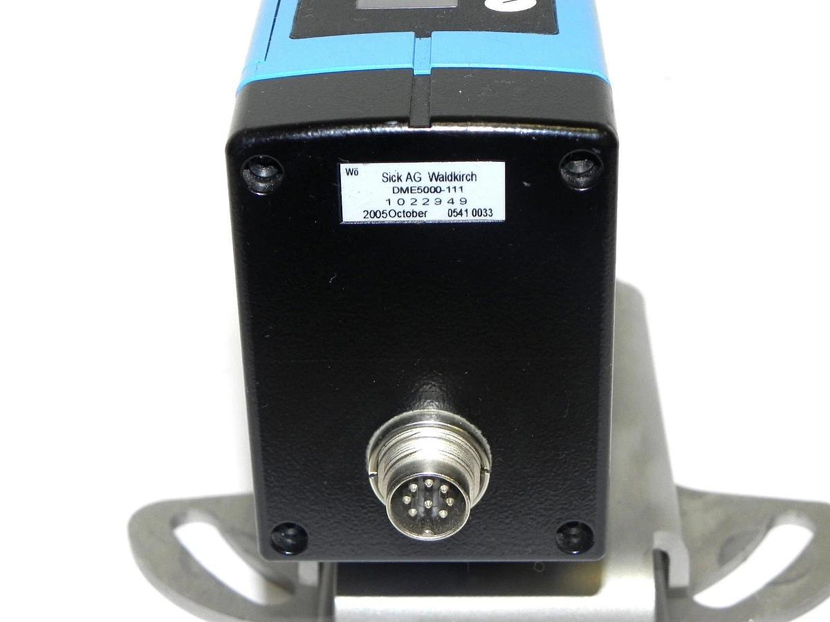Used SICK OPTIC DME5000-111 DISTANCE MEASURING DEVICE 1022949 DME5000111 W/BRACKET