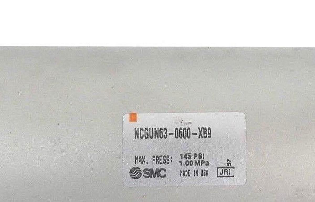 Used NEW SMC NCGUN63-0600-XB9 AIR CYLINDER MAX. PRESS: 145 PSI, 1.00 MPA