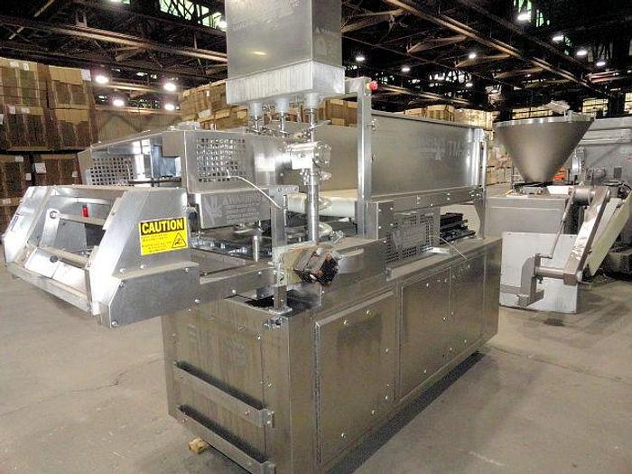 Used TOMAHAWK HIGH SPEED FORMING MACHINE WITH PAPER FEED AND SOFT FEED FILL SYSTEM TM-26