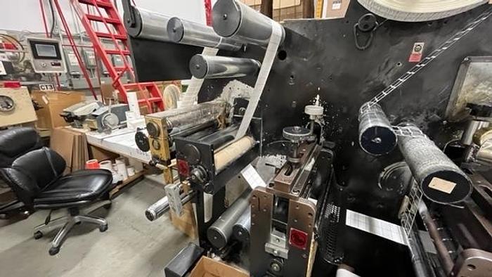 Used 13" WIDE ROTOFLEX SLITTER REWINDER WITH 2 STATION DIE CUTTING