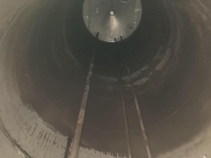 Used Used Wolfe Mechanical 20,000 gallon 304 stainless steel vertical storage tank. 