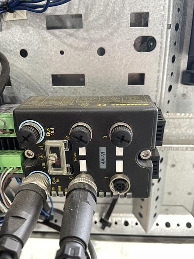 Used ABB IRB 2600-12/1.65 ROBOT WORK CELL CONSISTING OF 2 IRB 2600 ROBOTS RUNNING OFF OF 1 IRC5 CONTROLLER