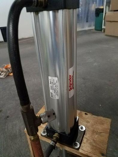 Used Schrader Bellows Eco Ram II Cylinder mounted on platform