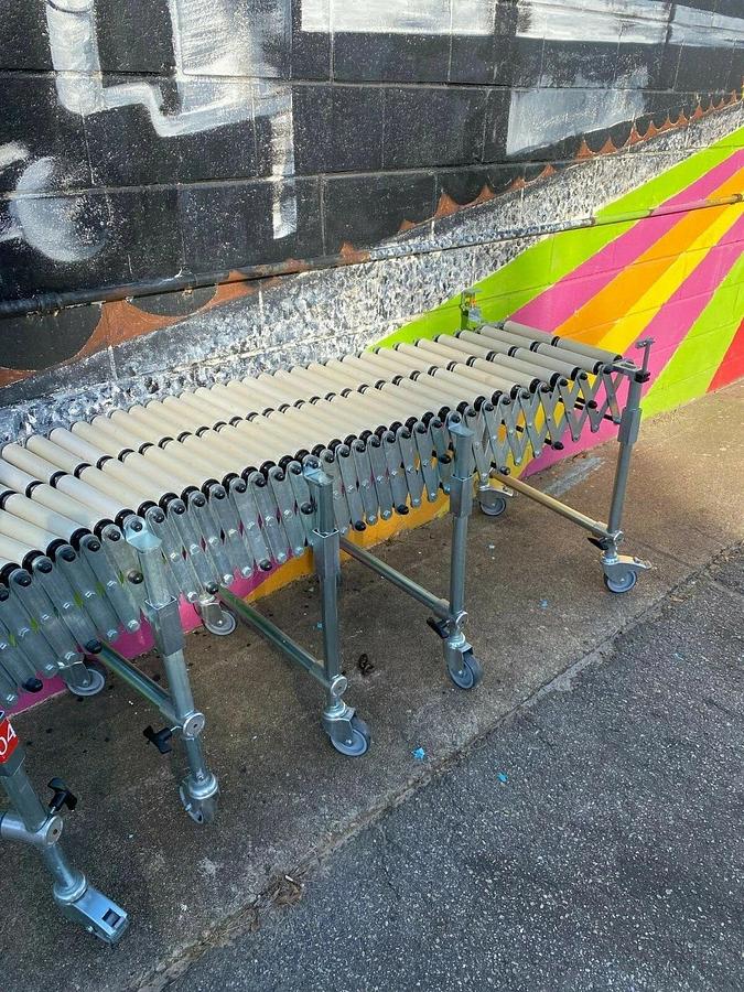 Used Matrex 89500 Portable Expandable Roller Conveyor, 6’ to 15’, On Casters