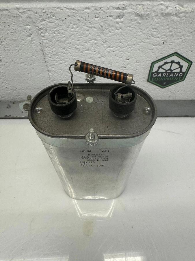 Used GE Dielektrol 23L6119 Oval Capacitor,  2500 VAC, 60Hz, 1.4uf