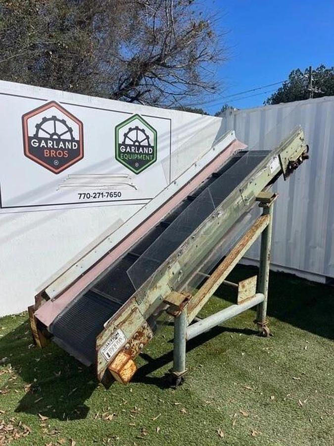 Used Conveyor Belt W: 28", L: 9'8" Cleated Incline w/ Leeson 2 HP at 1740 RPM