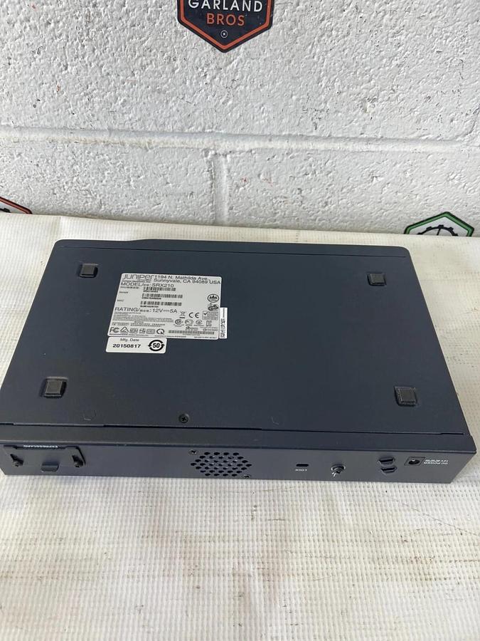 Used Juniper SRX210 8-Port 10/100 PoE Services Gateway - New