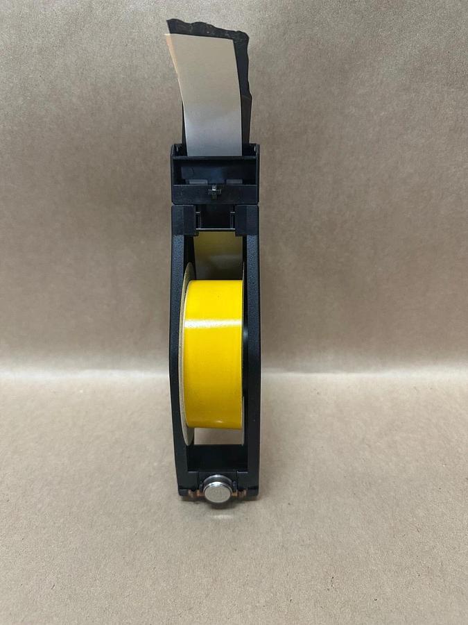 Used Brady B595 Black on Yellow, 1.125” x 90’ Label Cartridge, Roughly 2/3 Left