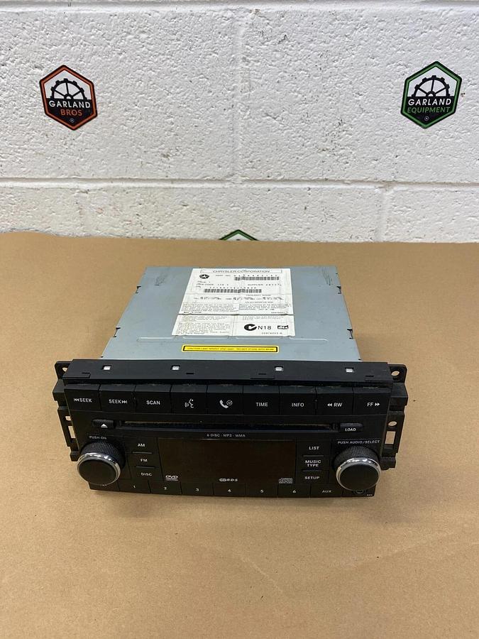 Used Chrysler Corp. 05064921 AE Jeep Radio AM/FM 6 Disc-MP3, WMA *WORKING*