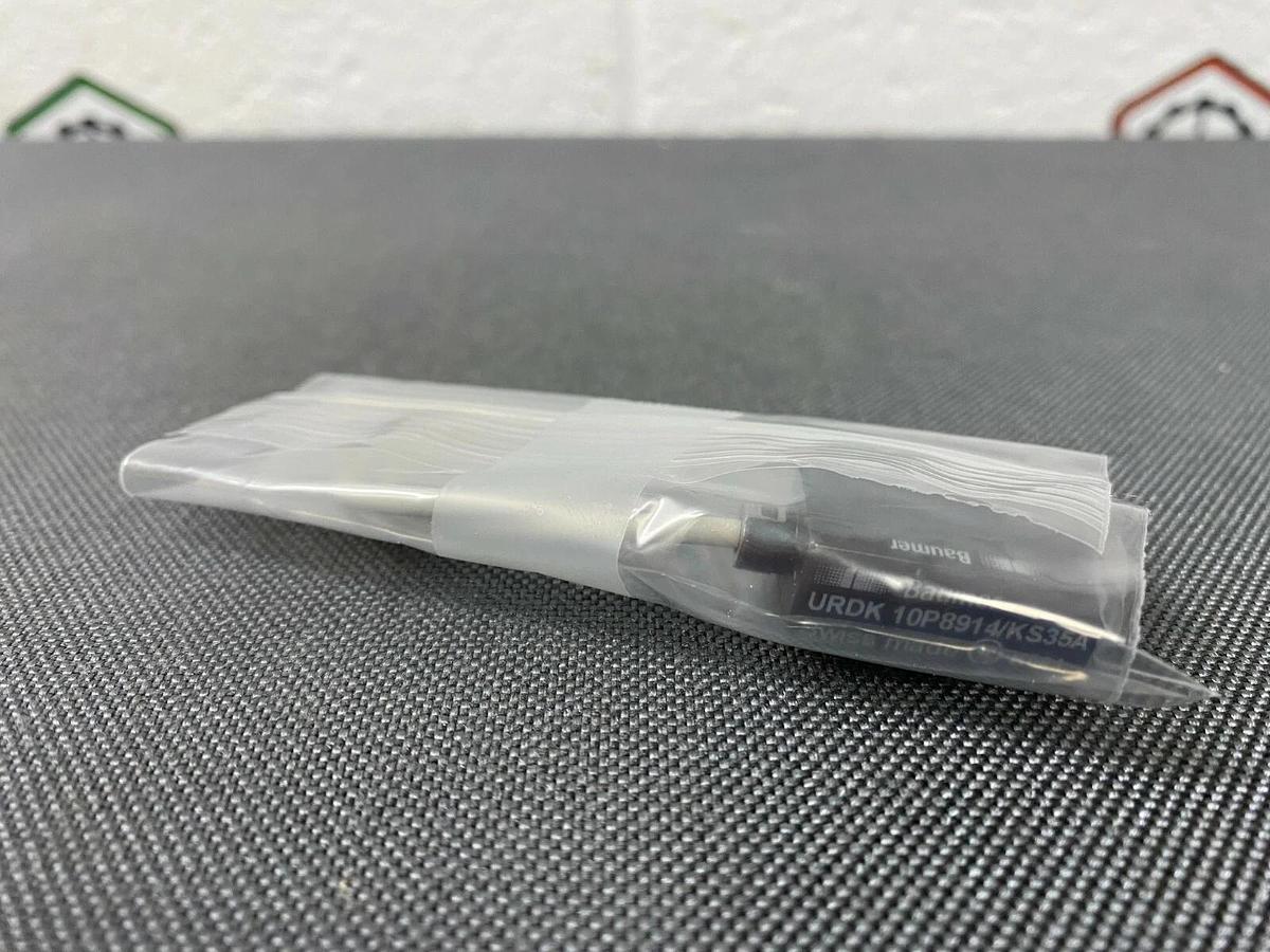Used Baumer URDK 10P8914/KS35A Miniature Ultrasonic Retro-Reflective Sensor