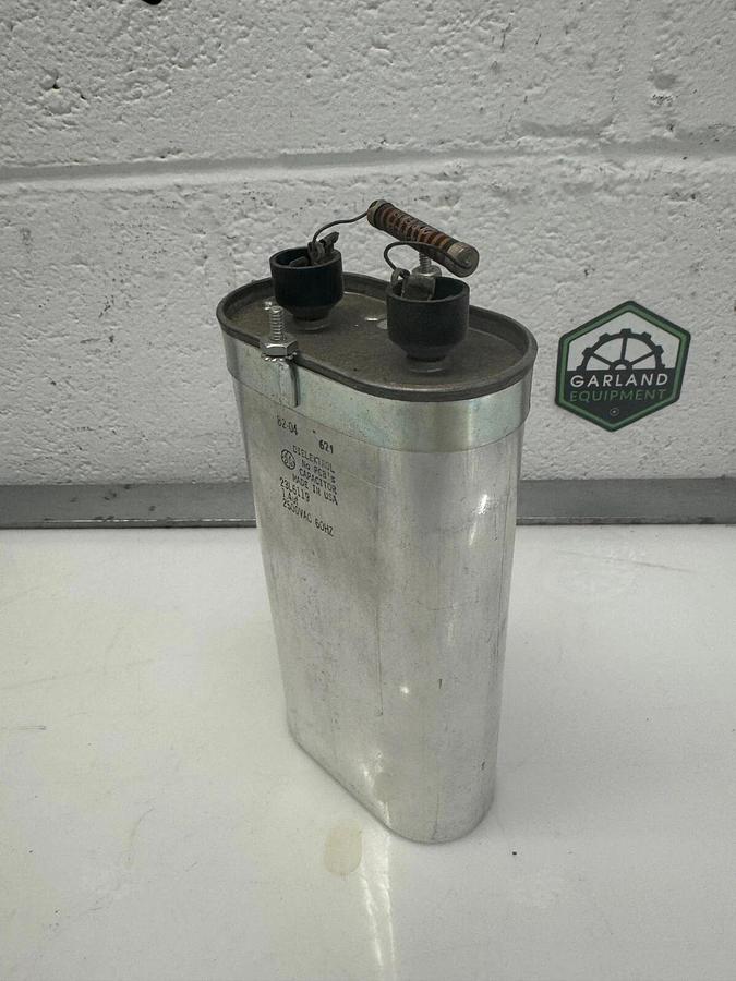 Used GE Dielektrol 23L6119 Oval Capacitor,  2500 VAC, 60Hz, 1.4uf