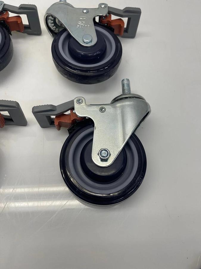 Used Globe 4" Caster Swivel Lock Med Duty 1” Tall Stem 1/2” Thread Polyurethane Wheel